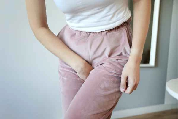 older woman running to the toilet because of urinary incontinence Teddington
