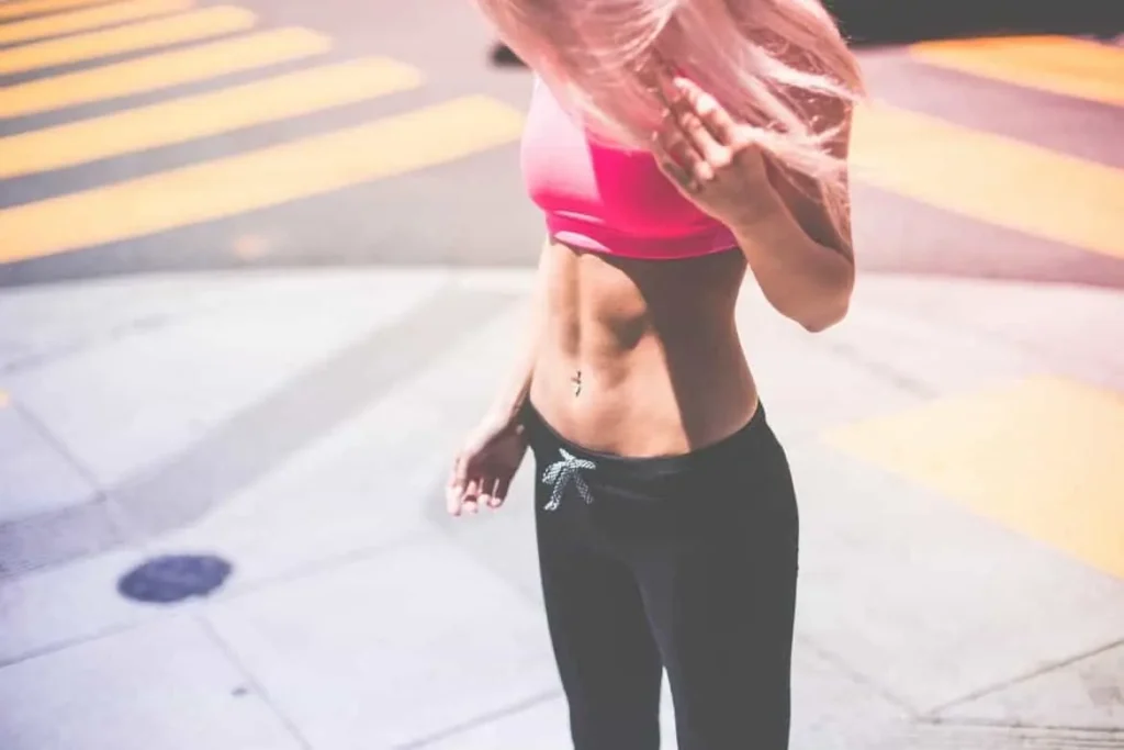 Woman with toned stomach after LA-EMS Body Sculpting Treatment Teddington